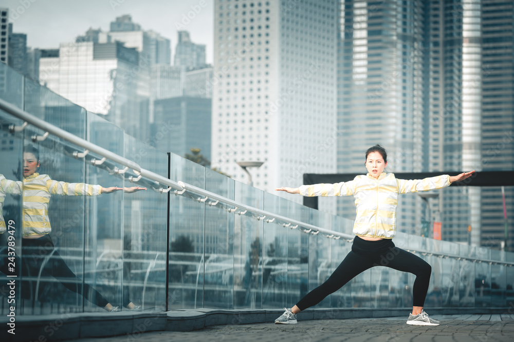 Young asian woman doing excusice in the city Young asian woman doing excusice in the city