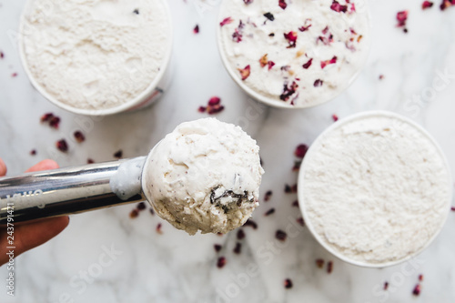 Overhead view of woman's hand holding ice cream scoop