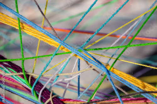 Colorful maze of string woven together