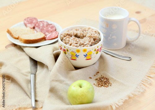 Breakfast-buckwheat porridge with sandwiches and milk