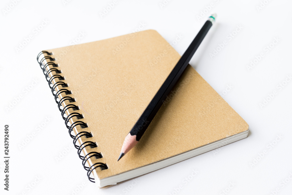 Notebook and pencil isolated on white background Notebook and pencil isolated on white background