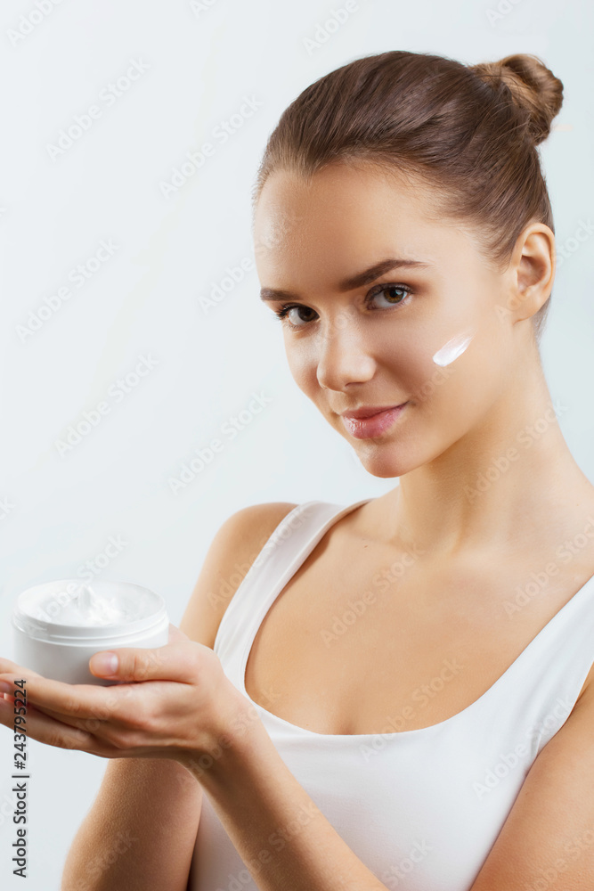 Skincare. Beauty Concept. Young Pretty Woman Holding Cosmetic Cream.Girl wiht fresh skin, antiaging concept.Spa. Beauty Concept. Female with fresh makeup and Perfect Skin Skincare. Beauty Concept. Young Pretty Woman Holding Cosmetic Cream.Girl wiht fresh skin, antiaging concept.Spa. Beauty Concept. Female with fresh makeup and Perfect Skin