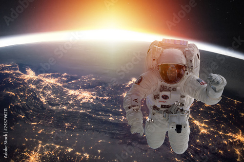 Fototapeta Naklejka Na Ścianę i Meble -  Planet Earth and astronaut