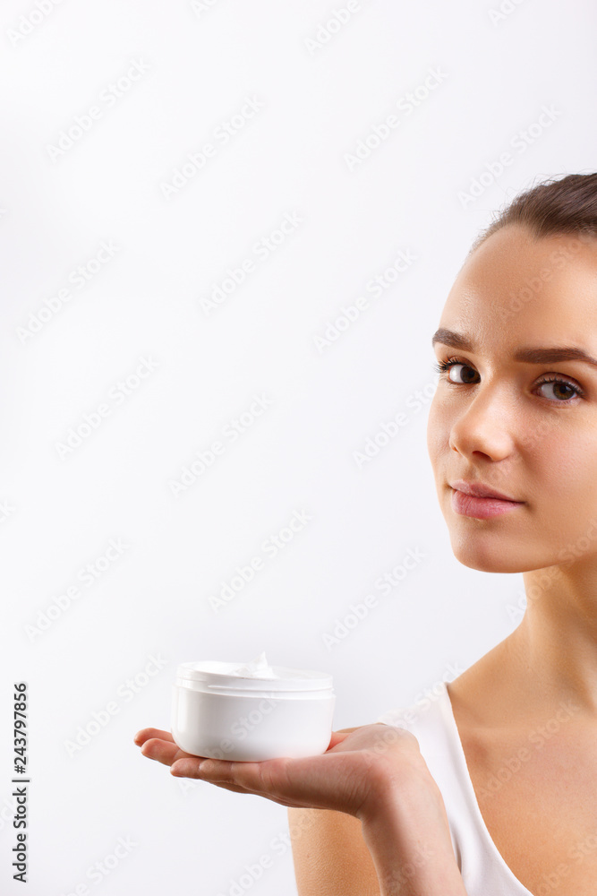 Skincare.Beautiful Young Woman with Clean Fresh Skin Holding Bottle. Beauty face care. Facial treatment. Cosmetology.Beauty and spa. Skincare.Beautiful Young Woman with Clean Fresh Skin Holding Bottle. Beauty face care. Facial treatment. Cosmetology.Beauty and spa.