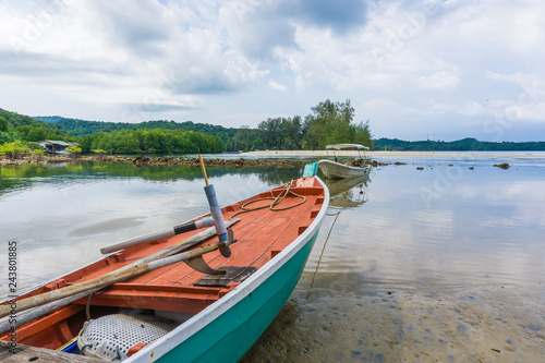 Wooden fishery boat on sea beach