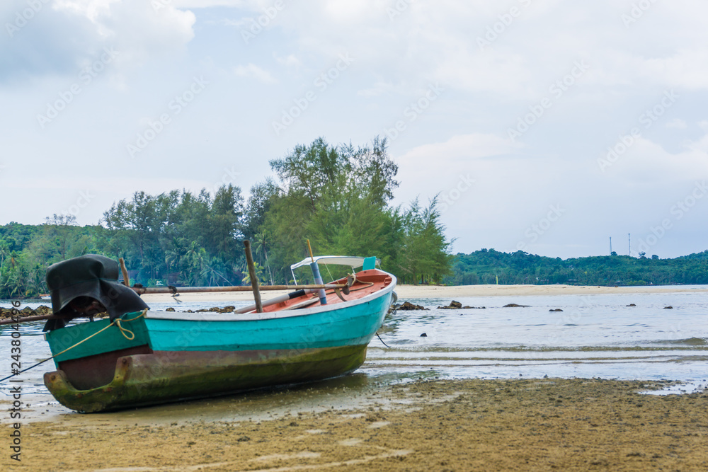 Wooden fishery boat on sea beach Wooden fishery boat on sea beach