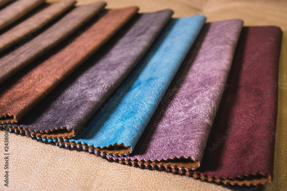 Colorful and bright fabric samples of furniture and clothing upholstery. Close-up of a palette of textile abstract stripes of different colors Colorful and bright fabric samples of furniture and clothing upholstery. Close-up of a palette of textile abstract stripes of different colors