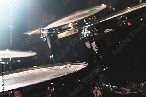 Photography Closeup view of a drum set in a dark studio