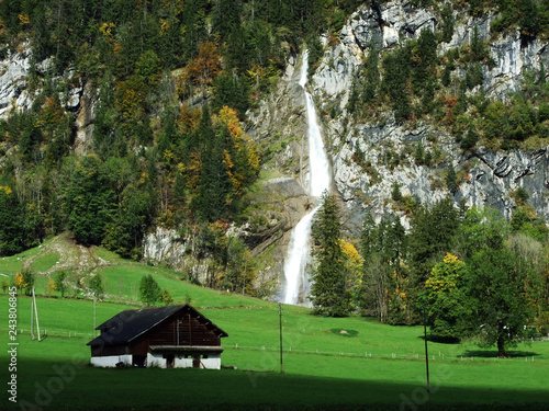 Sulzbachfall waterfall in the Klontal valley and next to Lake Klontalersee - Canton of Glarus, Switzerland photo