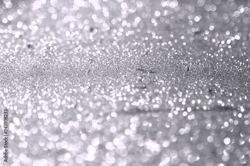 painted brassy sand made of glitters - festal concept with bokeh texture - nice abstract photo background