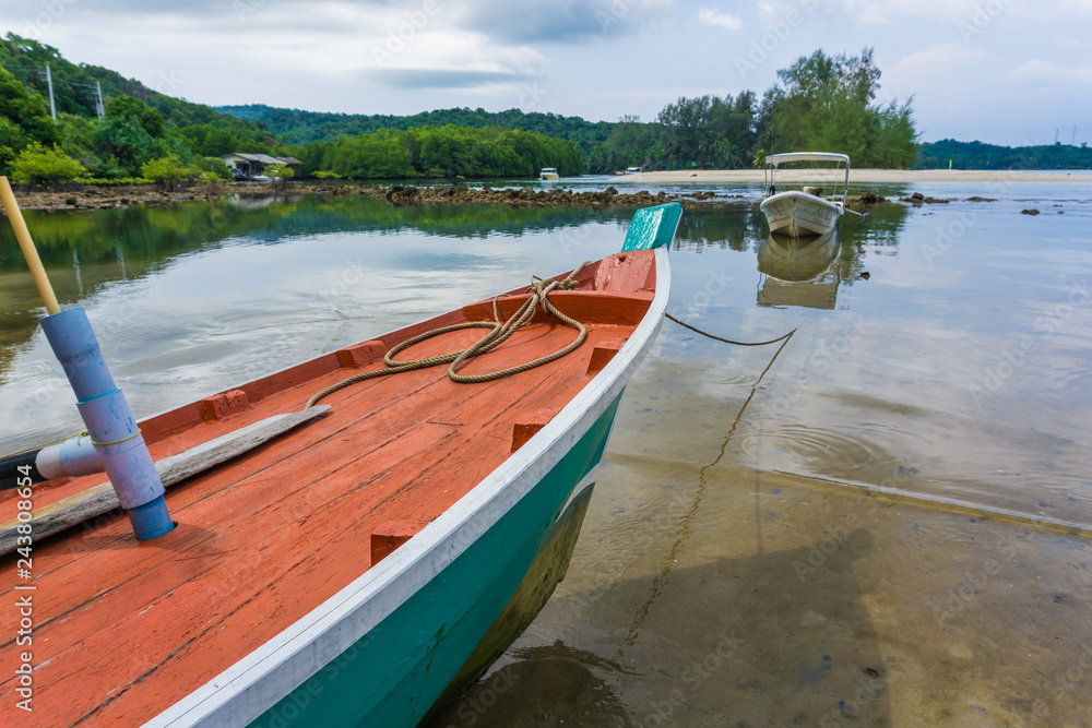 Wooden fishery boat on sea beach Wooden fishery boat on sea beach