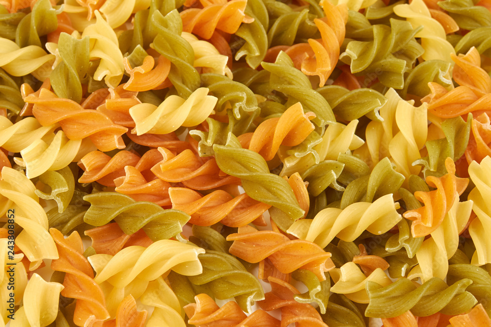 Raw colorful italian fusilli pasta isolated on white Raw colorful italian fusilli pasta isolated on white