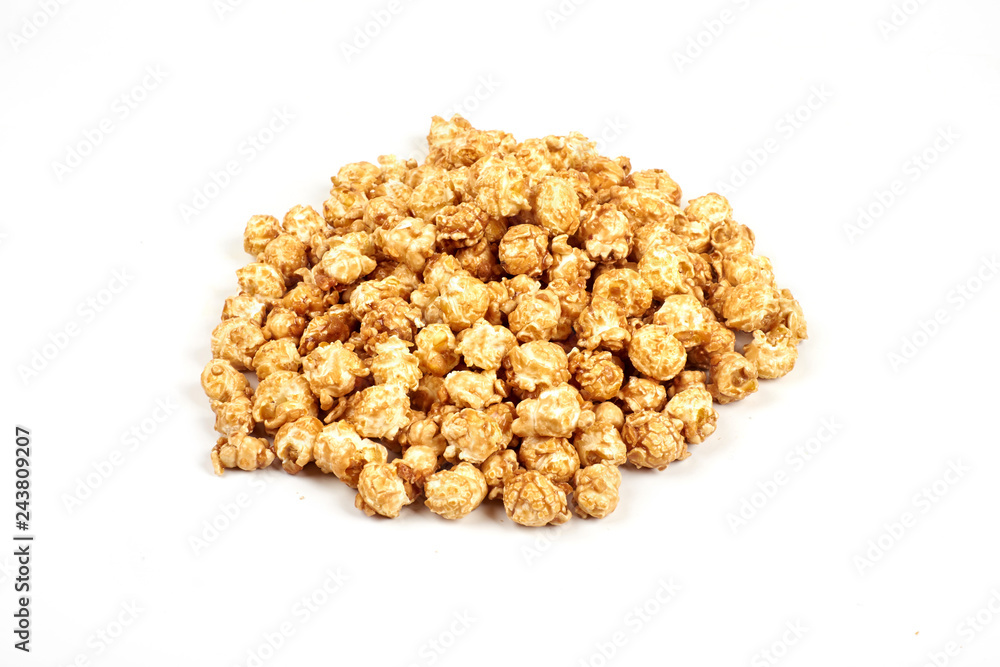 Pile of caramel popcorn on white background. Pile of caramel popcorn on white background.