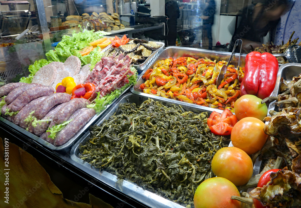 trays with vegetables and meat in a self-service restaurant
