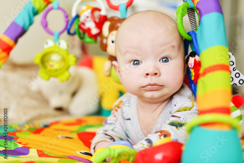  baby on the toy rug