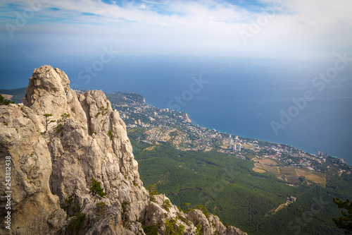 A beautiful landscape on the top of Mount Ai Petri, the town of Gaspra and the Black Sea in Crimea, background with vignette. © Viktor Fedorenko