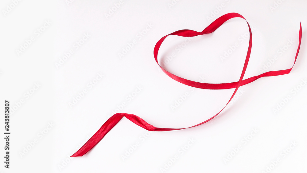 Heart of satin red ribbon-card for Valentine's day on white background. Top view. Heart of satin red ribbon-card for Valentine's day on white background. Top view.