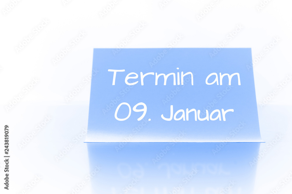 Termin am 9. Januar - blauer Zettel mit Notiz Termin am 9. Januar - blauer Zettel mit Notiz
