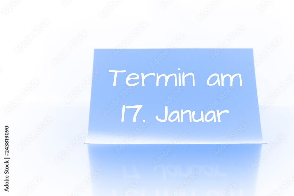 Termin am 17. Januar - blauer Zettel mit Notiz Termin am 17. Januar - blauer Zettel mit Notiz