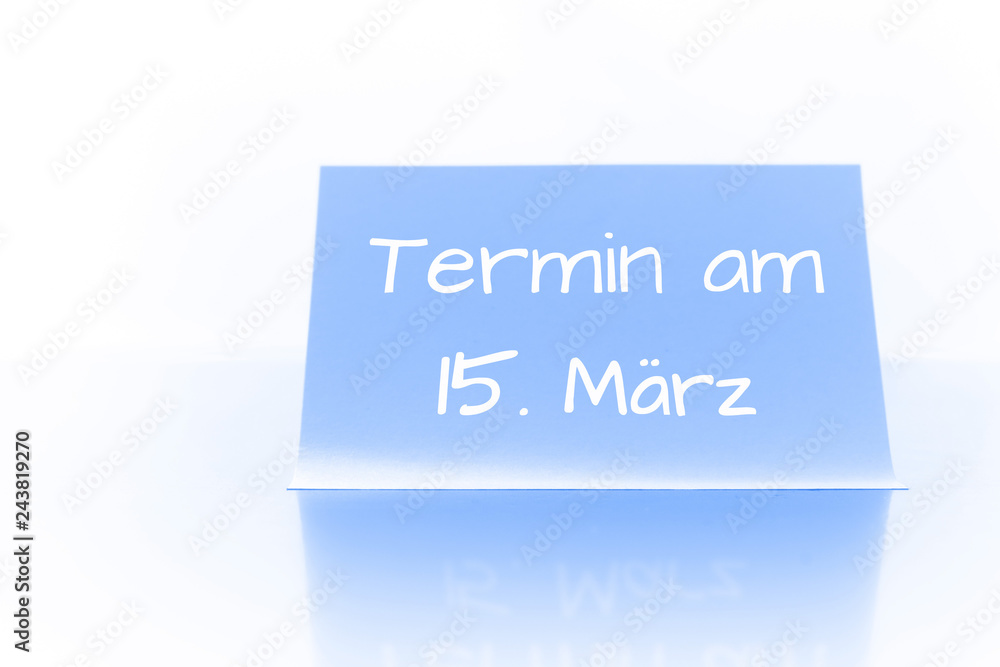 Termin am 15. März - blauer Zettel mit Notiz Termin am 15. März - blauer Zettel mit Notiz