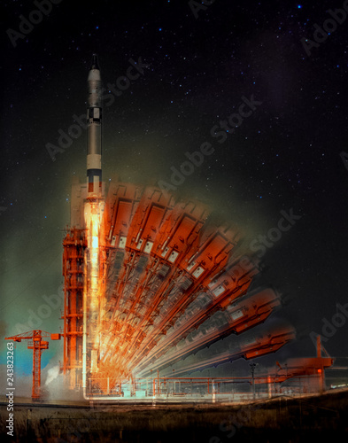 Missile launch at night. Illusion of multiple rocker arms. The elements of this image furnished by NASA.