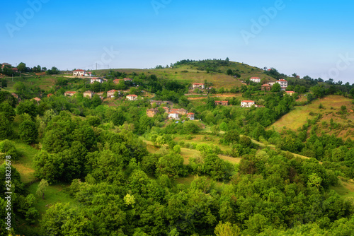 Spring is coming... Amazing spring view with a little village in Rhodopi Mountains, Bulgaria – Image. Magnificent landscape, green fields, small houses.