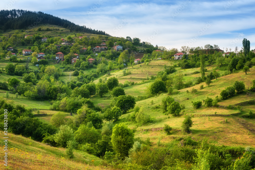 Spring is coming... Amazing spring view with a little village in Rhodopi Mountains, Bulgaria – Image. Magnificent landscape, green fields, small houses. Spring is coming... Amazing spring view with a little village in Rhodopi Mountains, Bulgaria – Image. Magnificent landscape, green fields, small houses.