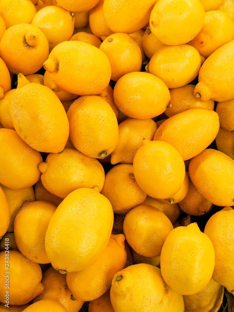 Ripe yellow lemons on a store window