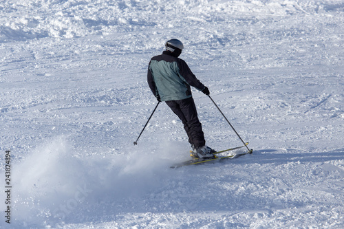 Man skiing in the snow in winter