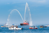Fire brigade ship with high splashes to the sky