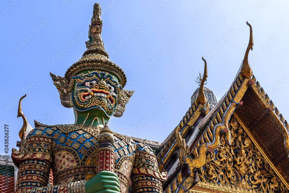 Naklejka premium Thai antique sculpture, giant sculpture at Wat Phra Keaw, temple of the emerald buddha, Bangkok
