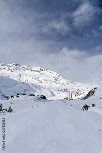 Panoramic view of a winter mountain landscape.