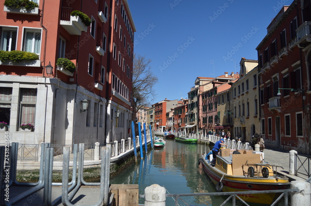 Narrow Canals With Boats Moored On Piers Of Buildings In Venice. Travel, Holidays, Architecture. March 27, 2015. Venice, Region Of Veneto, Italy.