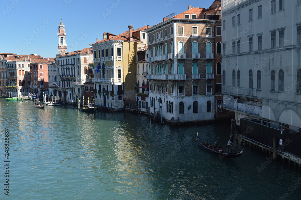 Gondolas Sailing Near The Beautiful Palaces Of The Grand Canal In Venice. Travel, Holidays, Architecture. March 27, 2015. Venice, Region Of Veneto, Italy.