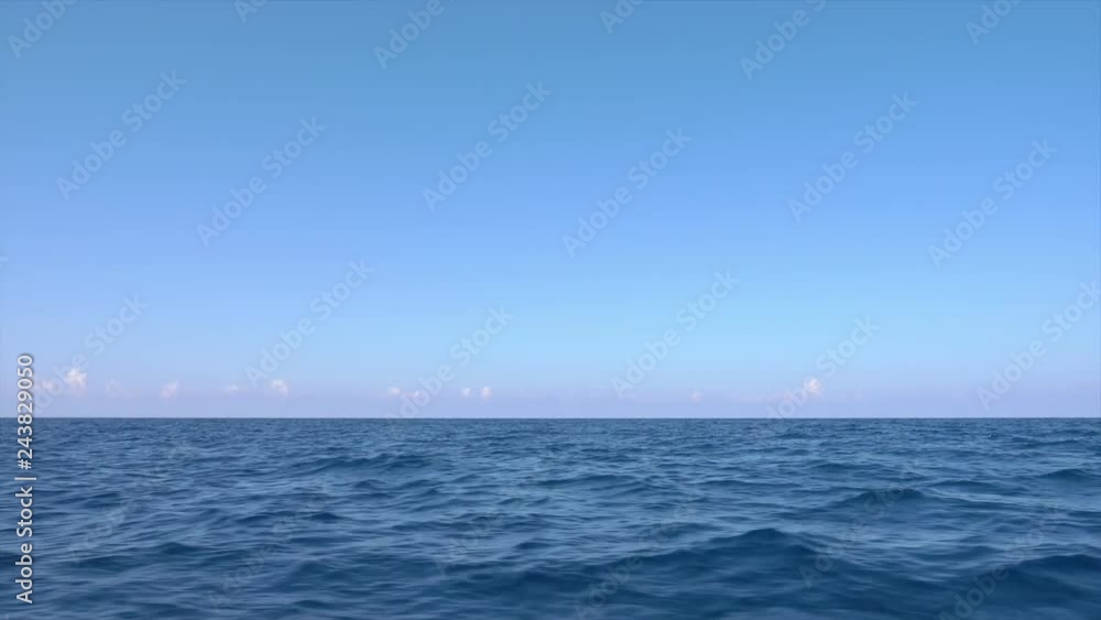 Blue sky and tranquil water at sea, horizon Blue sky and tranquil water at sea, horizon