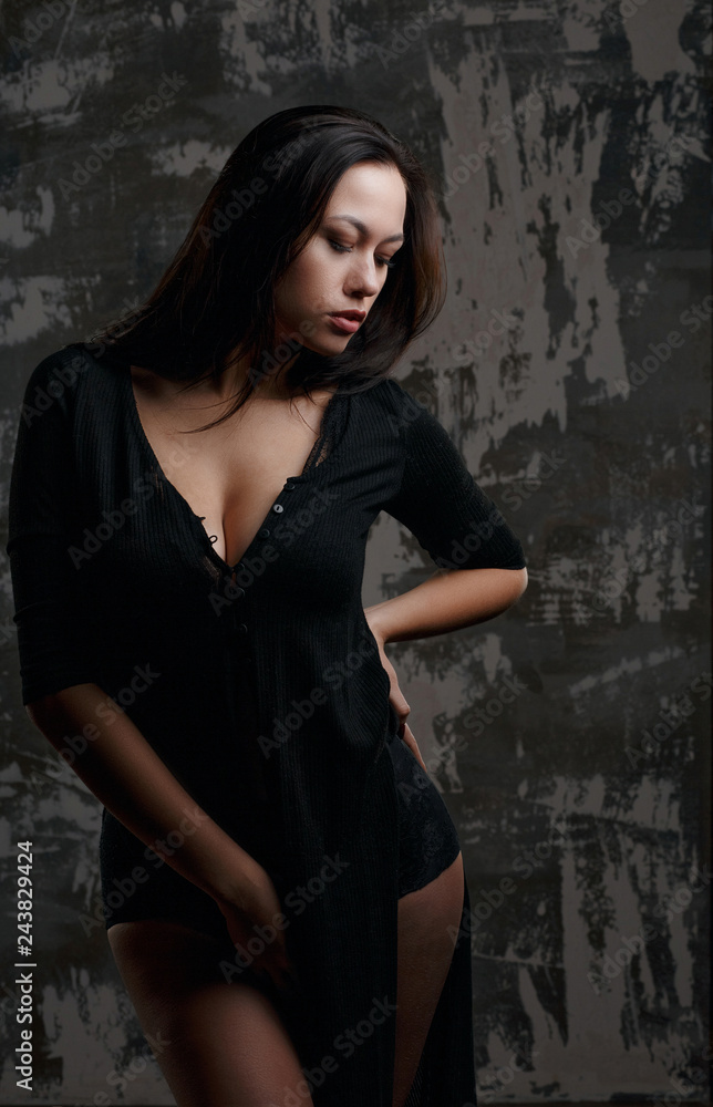 Studio portrait of young sexy model with perfect body posing with shadows Studio portrait of young sexy model with perfect body posing with shadows