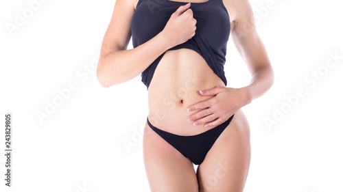 Woman in lingerie isolated on white background touches the belly. Menstruation and woman's health concept.