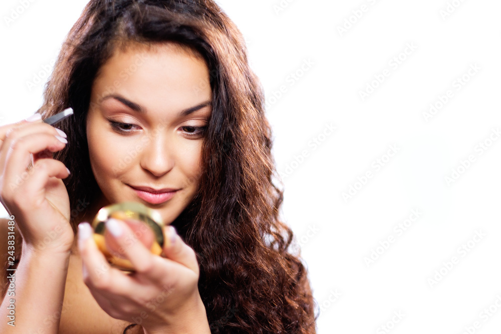Beautiful model applying make-up Beautiful model applying make-up