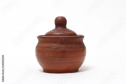 Clay dishes, pot with a lid made of clay isolated on white background