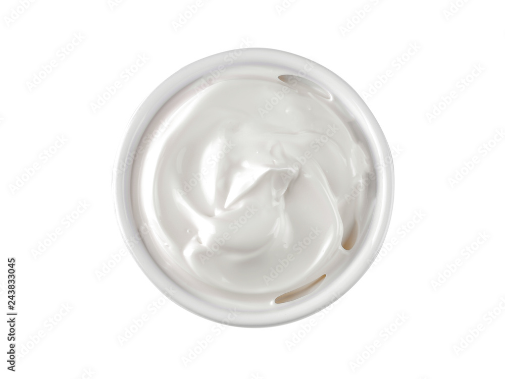 Mayonnaise in a white ceramic bowl on a white isolated background. white sauce. close-up. view from above Mayonnaise in a white ceramic bowl on a white isolated background. white sauce. close-up. view from above