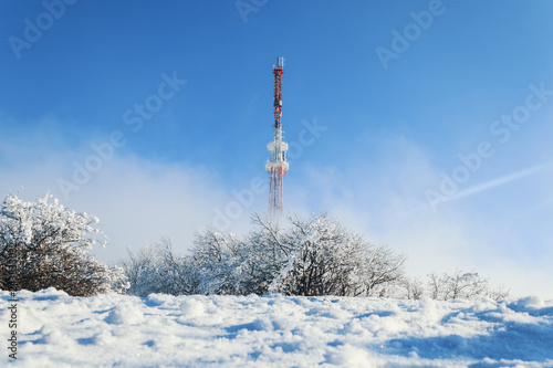 TV tower in the snow at the top of the mountain © Pyroll
