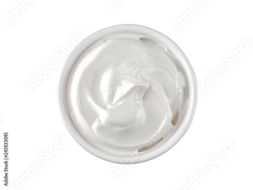 Mayonnaise in a white ceramic bowl on a white isolated background. white sauce. close-up. view from above
