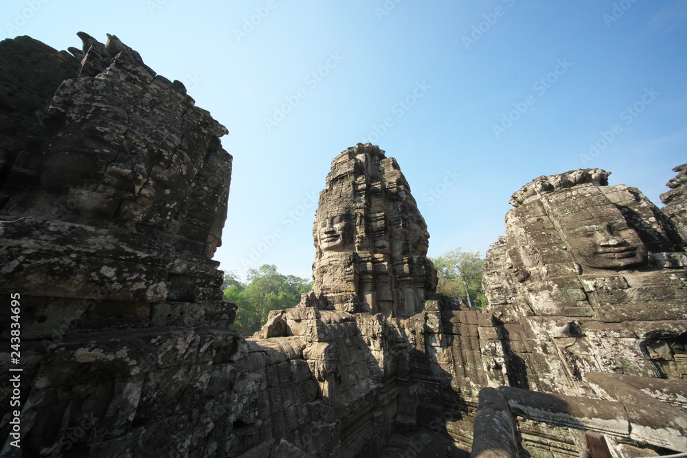 Siem Reap,Cambodia-Januay 11, 2019: Bodhisattva face towers viewed from the upper terrace of Bayon, Angkor Thom, Siem Reap
