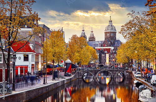 Canvas Print Amsterdam, Netherlands. Autumn sunset in Red-light district.