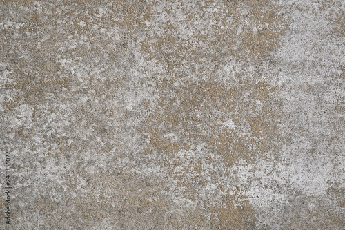 weathered concrete stone wall background texture pattern with white paint mostly peeled off