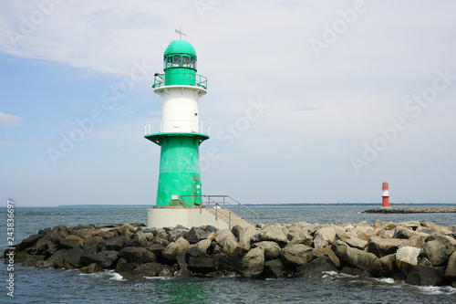 green and red breakwater lights at harbor entrance in Rostock Warnemunde, Germany