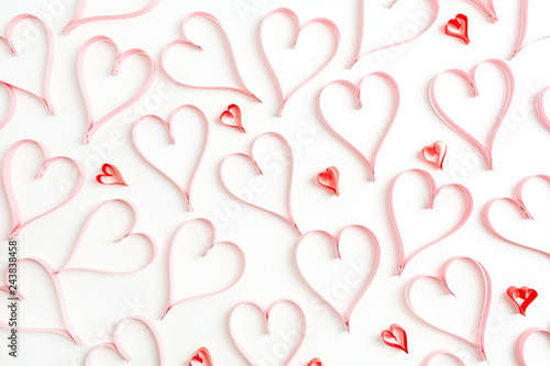 Valentines Day background with paper heart symbols on white. Flat lay, top view love concept.