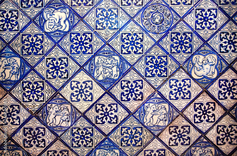 Patterned spanish design of old house tile. Historical walls decoration in Spain