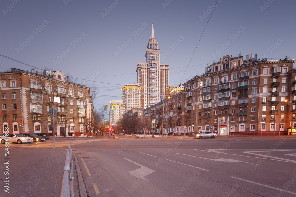 Moscow, Russia. The intersection with views of the tallest apartment building Triumph Palace. City streets on a winter evening