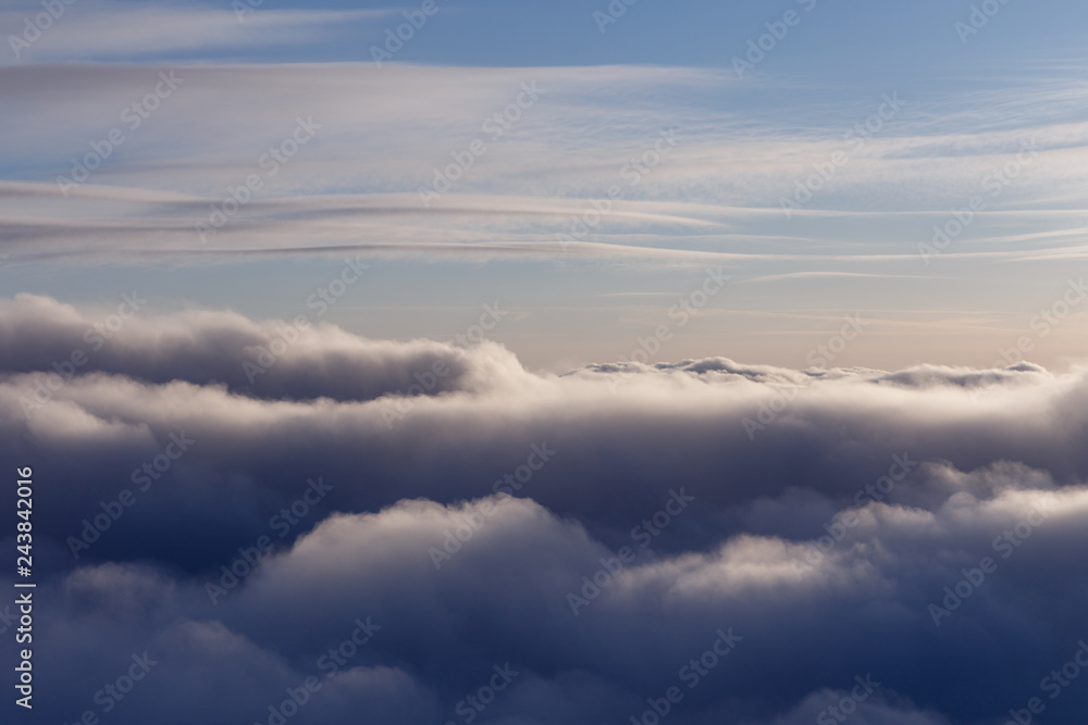 View from a plane flying through the clouds